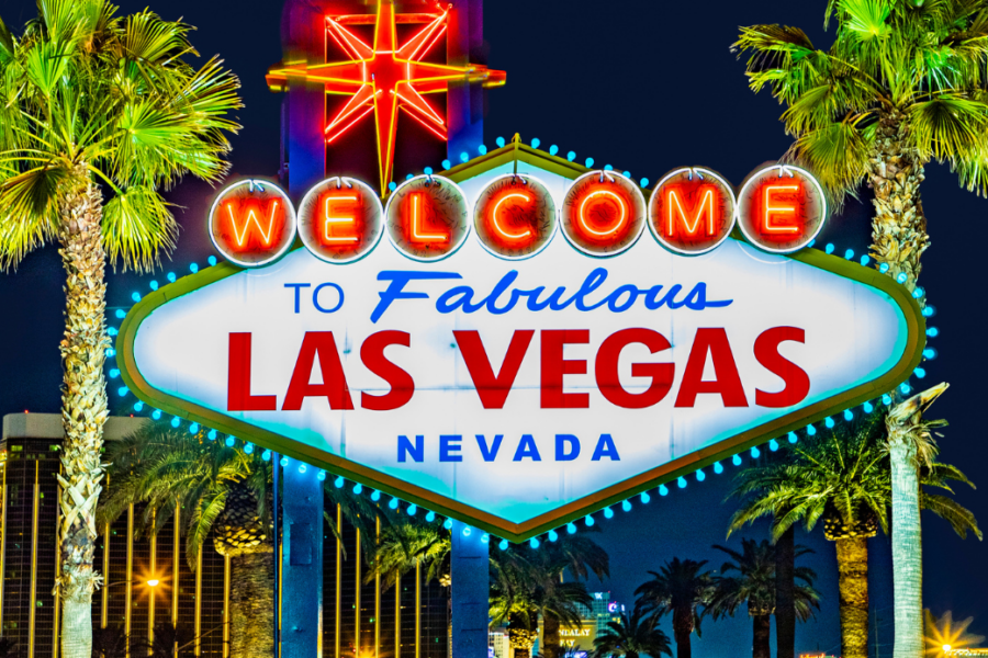 Iconic "Welcome to Fabulous Las Vegas Nevada" neon sign with palm trees.