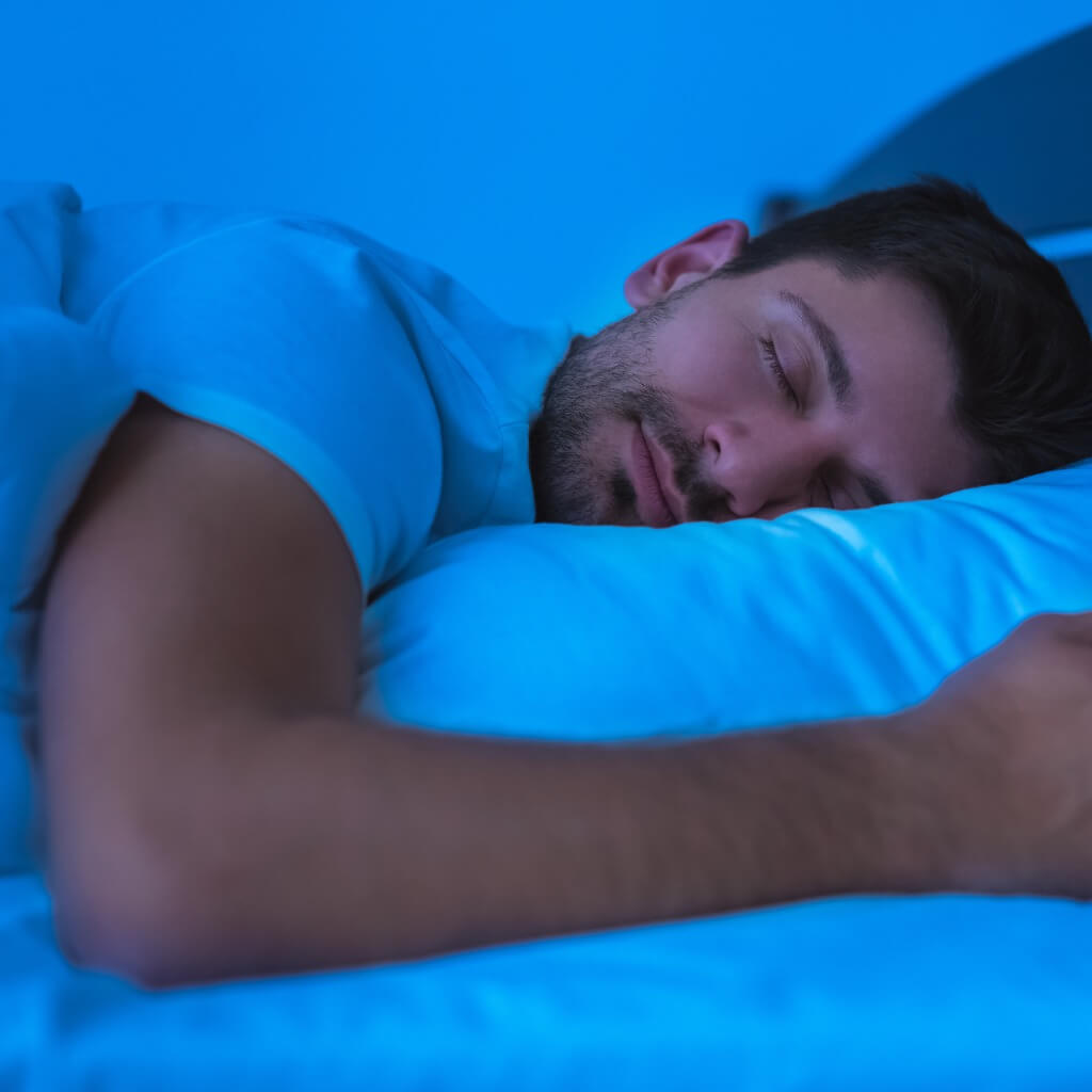 A man sleeping soundly despite job stress.