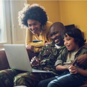 Black family with a laptop searching for military freebies.